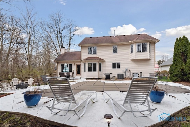 2016 Austin Bluffs Ct, Toledo, OH 43615 - rear view of property with a patio area, cooling unit, and a chimney