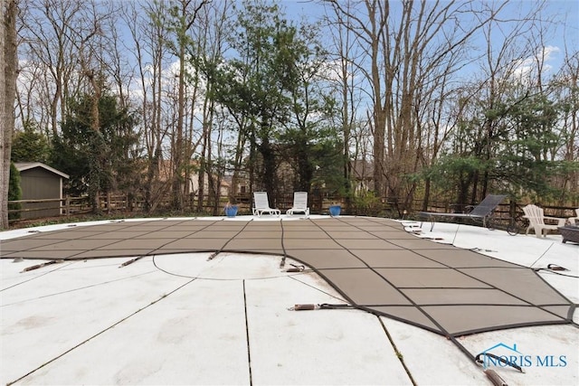 2016 Austin Bluffs Ct, Toledo, OH 43615 - view of swimming pool with a patio, a covered pool, and fence