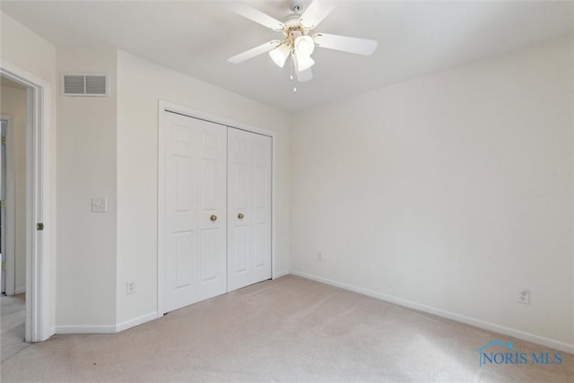 2016 Austin Bluffs Ct, Toledo, OH 43615 - unfurnished bedroom featuring ceiling fan, a closet, visible vents, light carpet, and baseboards