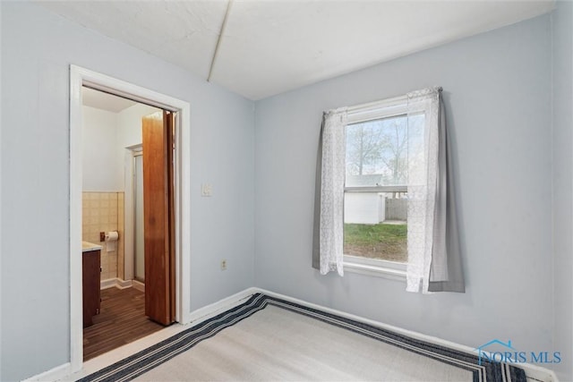 unfurnished bedroom with baseboards