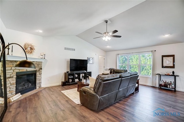 630 Weatherby Ct, Findlay, OH 45840 - living room featuring lofted ceiling, ceiling fan, visible vents, a fireplace, and wood finished floors