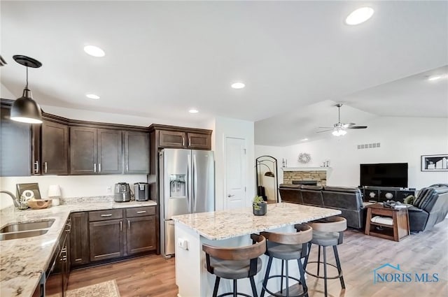 630 Weatherby Ct, Findlay, OH 45840 - kitchen featuring light stone counters, a sink, stainless steel appliances, visible vents, and dark brown cabinets