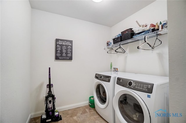 630 Weatherby Ct, Findlay, OH 45840 - laundry room with baseboards, separate washer and dryer, and laundry area