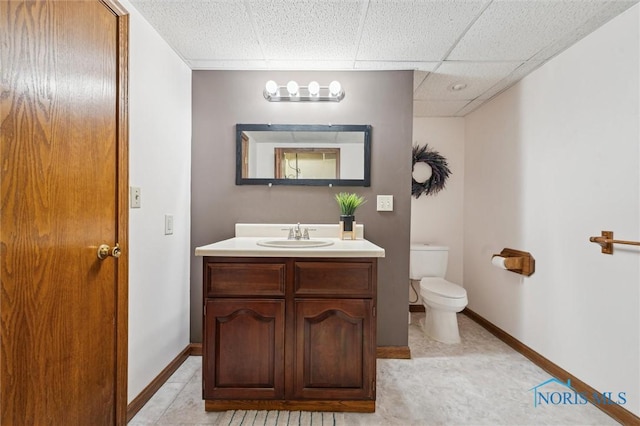 3011 Heather Downs Dr, Findlay, OH 45840 - bathroom featuring toilet, a paneled ceiling, vanity, and baseboards