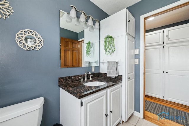 3011 Heather Downs Dr, Findlay, OH 45840 - bathroom with toilet, vanity, and tile patterned flooring