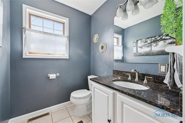 3011 Heather Downs Dr, Findlay, OH 45840 - half bath with tile patterned flooring, plenty of natural light, baseboards, and toilet