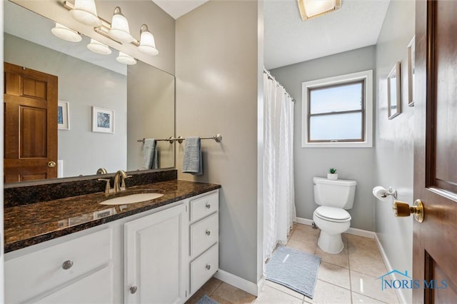 3011 Heather Downs Dr, Findlay, OH 45840 - full bath featuring toilet, vanity, baseboards, and tile patterned flooring