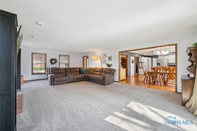 3011 Heather Downs Dr, Findlay, OH 45840 - carpeted living area featuring a chandelier and a wood stove