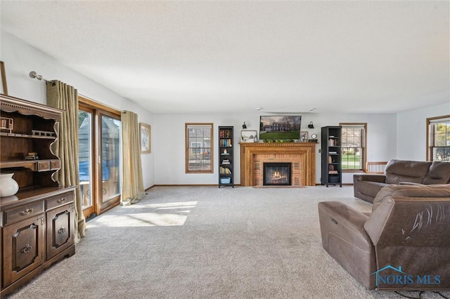 3011 Heather Downs Dr, Findlay, OH 45840 - living area with baseboards, a fireplace, and carpet