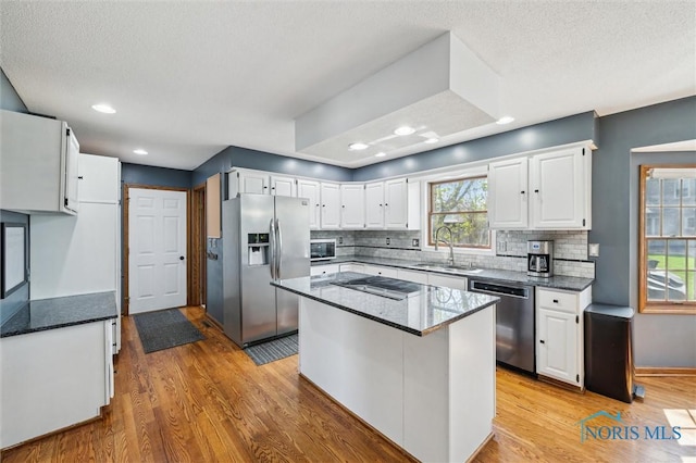 3011 Heather Downs Dr, Findlay, OH 45840 - kitchen with light wood-type flooring, a sink, white cabinetry, and stainless steel appliances