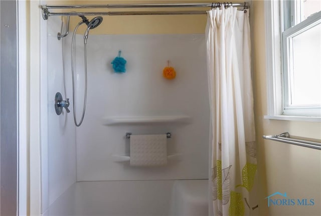 bathroom featuring a shower with curtain