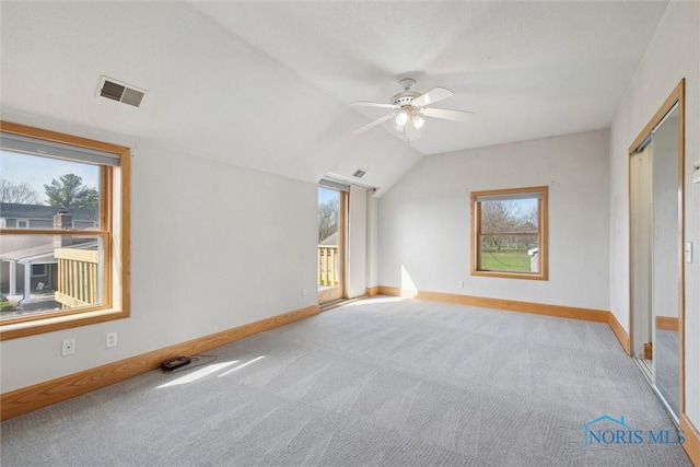 371 Canal Rd, Waterville, OH 43566 - unfurnished bedroom featuring baseboards, vaulted ceiling, carpet, and visible vents