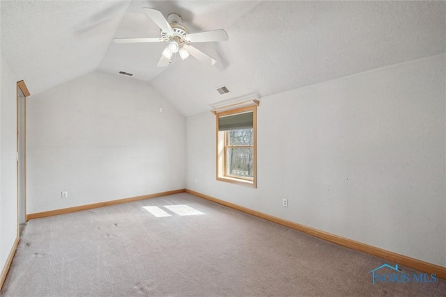 371 Canal Rd, Waterville, OH 43566 - carpeted empty room with visible vents, baseboards, ceiling fan, and vaulted ceiling