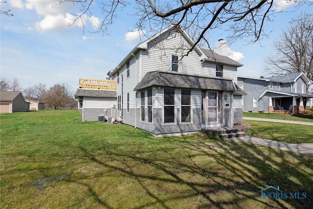 371 Canal Rd, Waterville, OH 43566 - rear view of house with a yard, central air condition unit, and a chimney