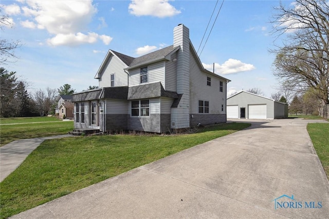 371 Canal Rd, Waterville, OH 43566 - view of property exterior with a shingled roof, a yard, a garage, a chimney, and an outdoor structure