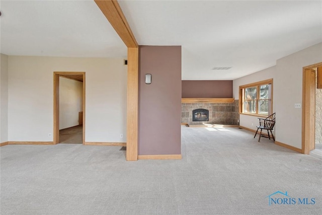 371 Canal Rd, Waterville, OH 43566 - unfurnished living room with a fireplace, carpet flooring, visible vents, and baseboards