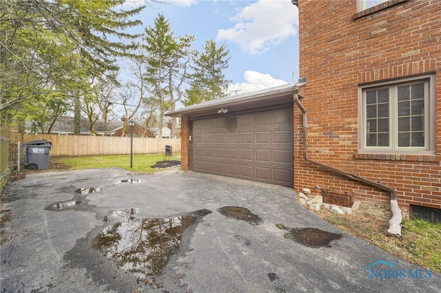 garage with fence