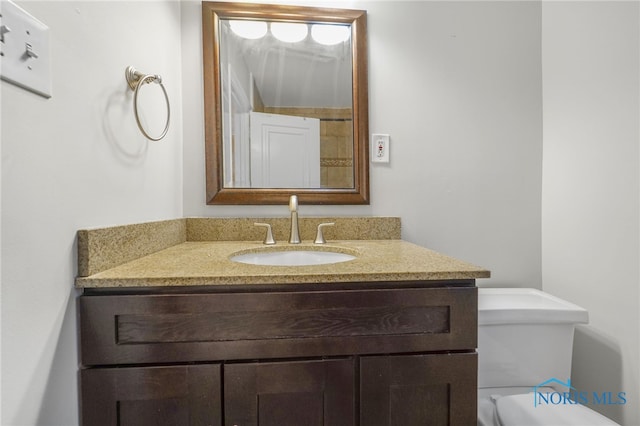 half bath with toilet and vanity