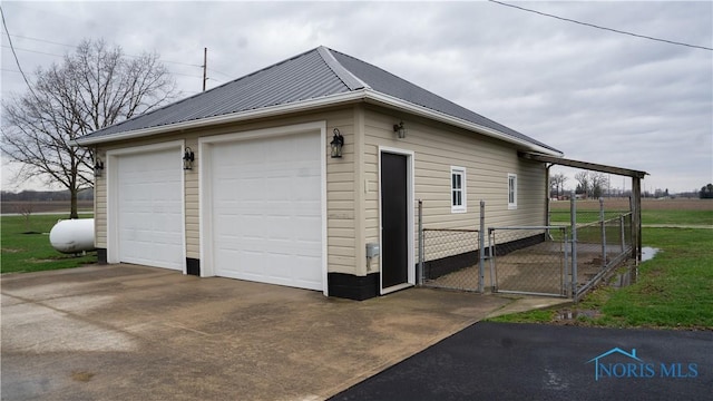 detached garage featuring a gate