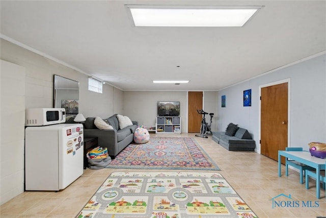 living room featuring light tile patterned floors and crown molding