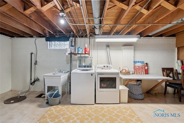 laundry room featuring laundry area and separate washer and dryer