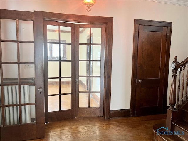 entryway featuring french doors and wood finished floors