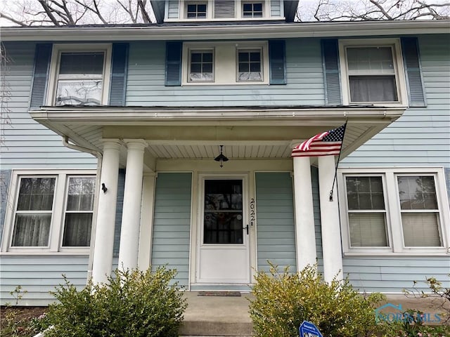 doorway to property featuring a porch