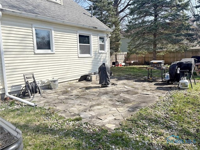 view of patio / terrace featuring fence