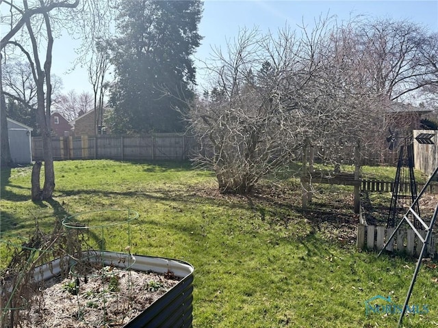 view of yard featuring a garden and fence