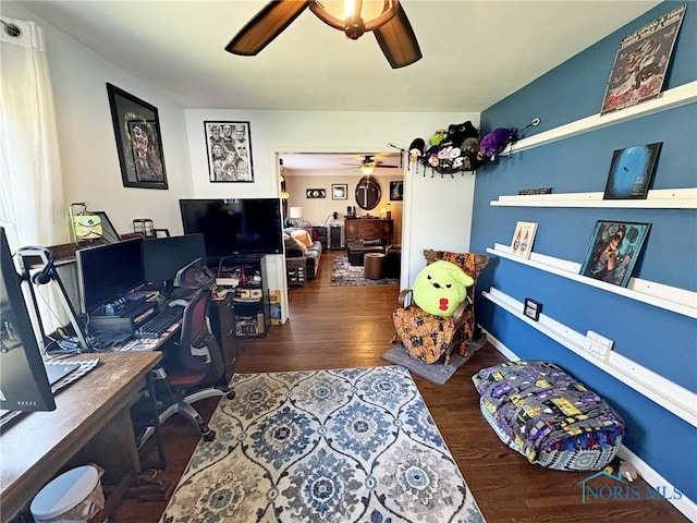 office space with ceiling fan, wood finished floors, and baseboards