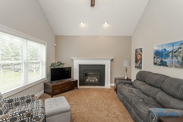 3643 Boulder Ridge Dr, Maumee, OH 43537 - living area with high vaulted ceiling, ceiling fan, a fireplace, baseboards, and carpet flooring