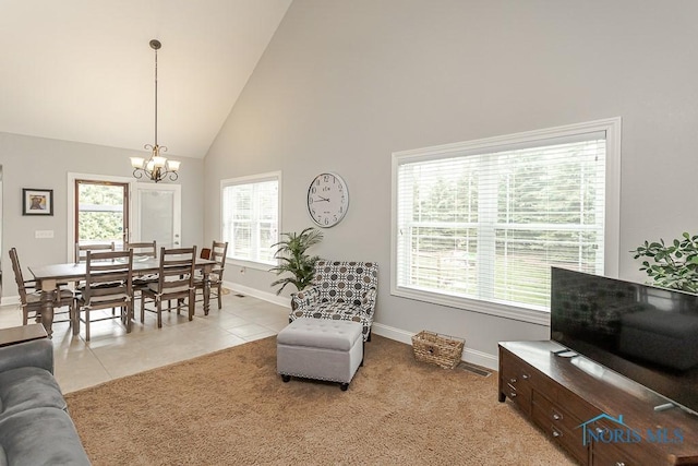 3643 Boulder Ridge Dr, Maumee, OH 43537 - living room featuring baseboards, high vaulted ceiling, a chandelier, and light tile patterned floors