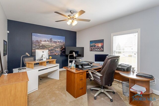 3643 Boulder Ridge Dr, Maumee, OH 43537 - home office with light colored carpet, ceiling fan, and baseboards