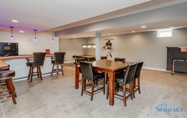 3643 Boulder Ridge Dr, Maumee, OH 43537 - dining area featuring light tile patterned floors, baseboards, recessed lighting, and bar