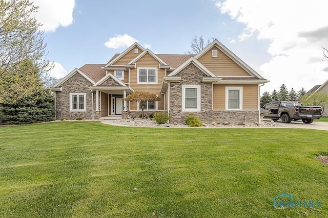 3643 Boulder Ridge Dr, Maumee, OH 43537 - craftsman-style home with stone siding and a front lawn