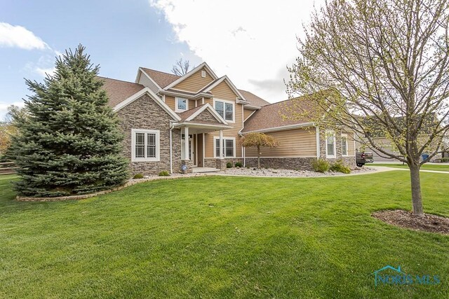 3643 Boulder Ridge Dr, Maumee, OH 43537 - craftsman-style home featuring stone siding and a front yard