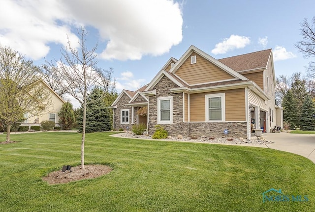 3643 Boulder Ridge Dr, Maumee, OH 43537 - craftsman-style house featuring stone siding, a front lawn, driveway, and a garage