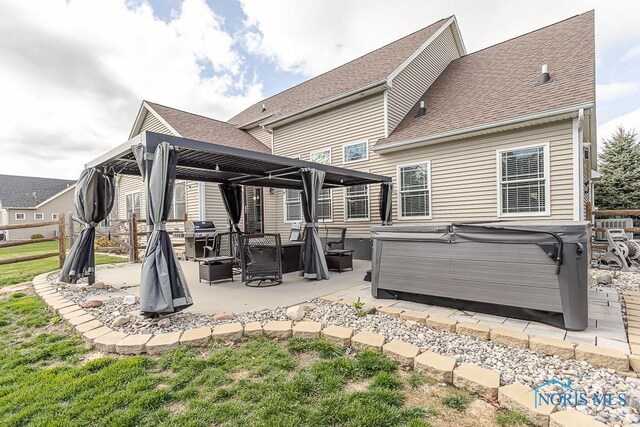 3643 Boulder Ridge Dr, Maumee, OH 43537 - rear view of property with a patio area, a gazebo, a hot tub, and roof with shingles