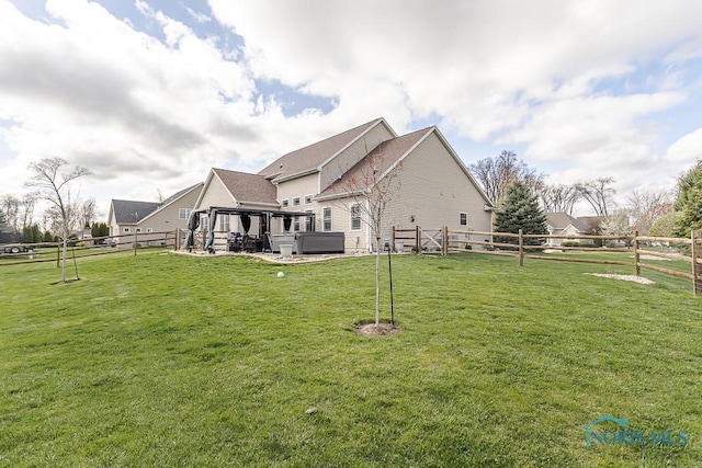 3643 Boulder Ridge Dr, Maumee, OH 43537 - view of side of property featuring a fenced backyard, a yard, and a hot tub