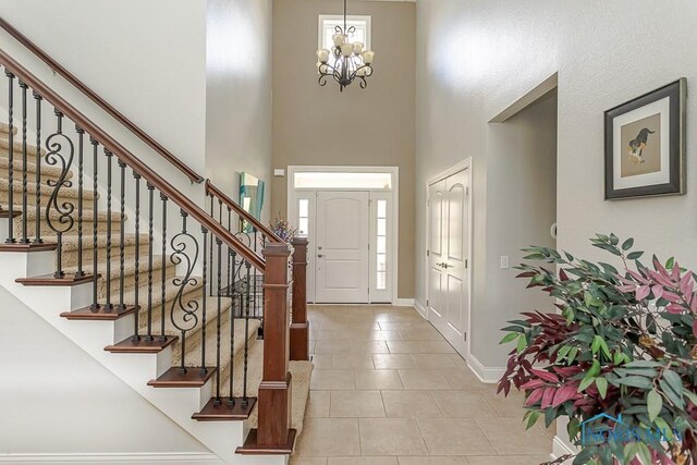 3643 Boulder Ridge Dr, Maumee, OH 43537 - tiled foyer entrance featuring baseboards, a high ceiling, a wealth of natural light, and stairs