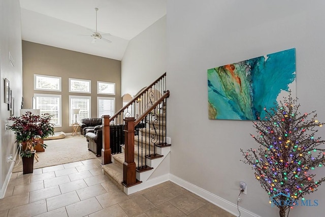 3643 Boulder Ridge Dr, Maumee, OH 43537 - stairs with a towering ceiling, baseboards, and a ceiling fan