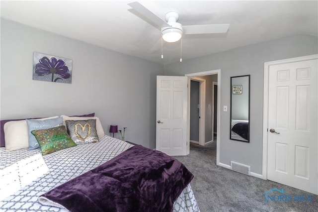 carpeted bedroom featuring visible vents, baseboards, and ceiling fan