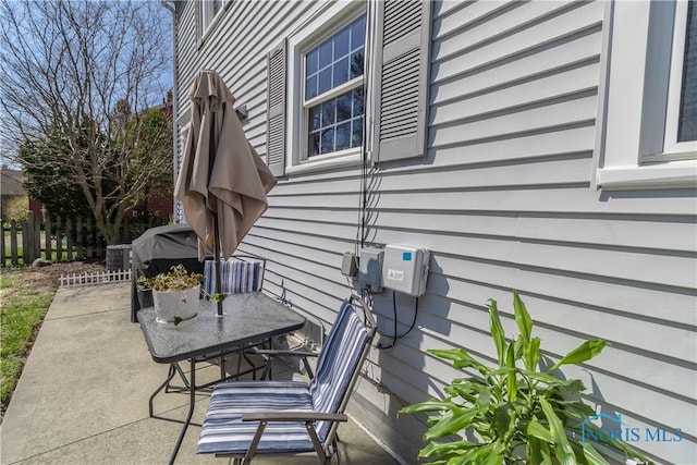view of patio featuring fence