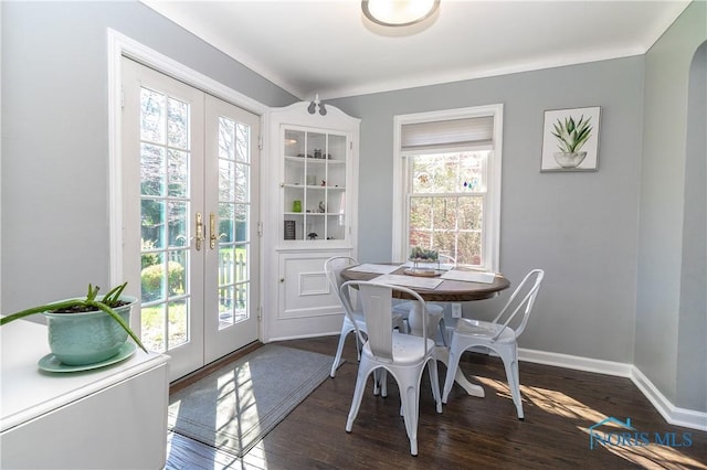 dining room with french doors, baseboards, and dark wood finished floors