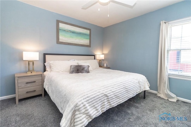 carpeted bedroom with baseboards and a ceiling fan