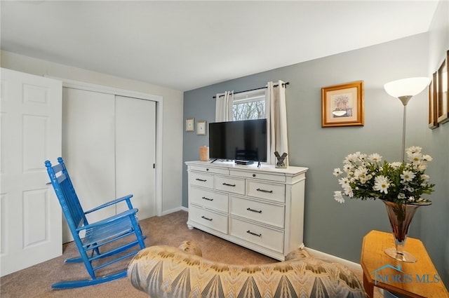 2257 N Carriage Ln, Port Clinton, OH 43452 - living area with baseboards and light colored carpet