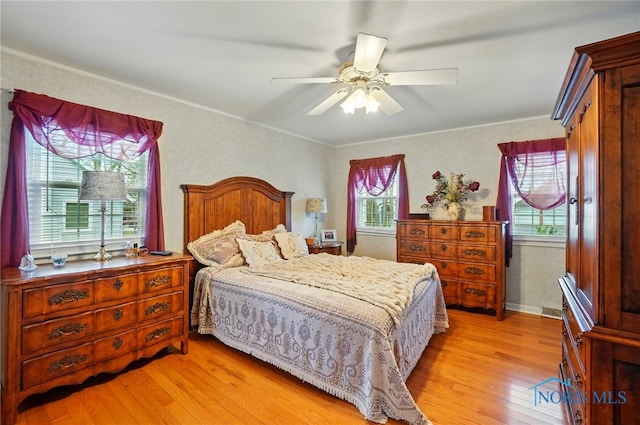 2257 N Carriage Ln, Port Clinton, OH 43452 - bedroom featuring ornamental molding, light wood-style flooring, and ceiling fan