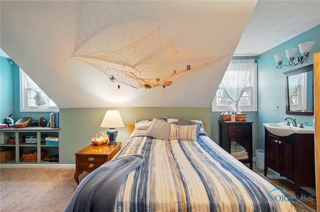 2257 N Carriage Ln, Port Clinton, OH 43452 - bedroom featuring lofted ceiling, a sink, and carpet floors