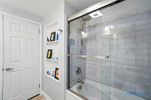 2257 N Carriage Ln, Port Clinton, OH 43452 - bathroom featuring bath / shower combo with glass door
