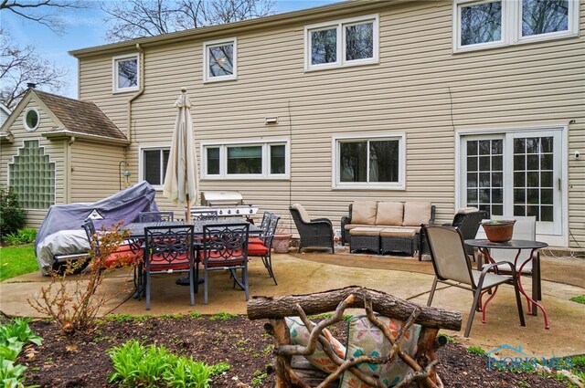 2257 N Carriage Ln, Port Clinton, OH 43452 - back of property featuring a patio area and an outdoor hangout area